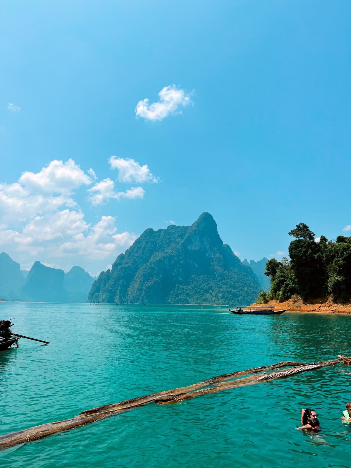A limestone peak rising above the turquoise water of Cheow Lan Lake