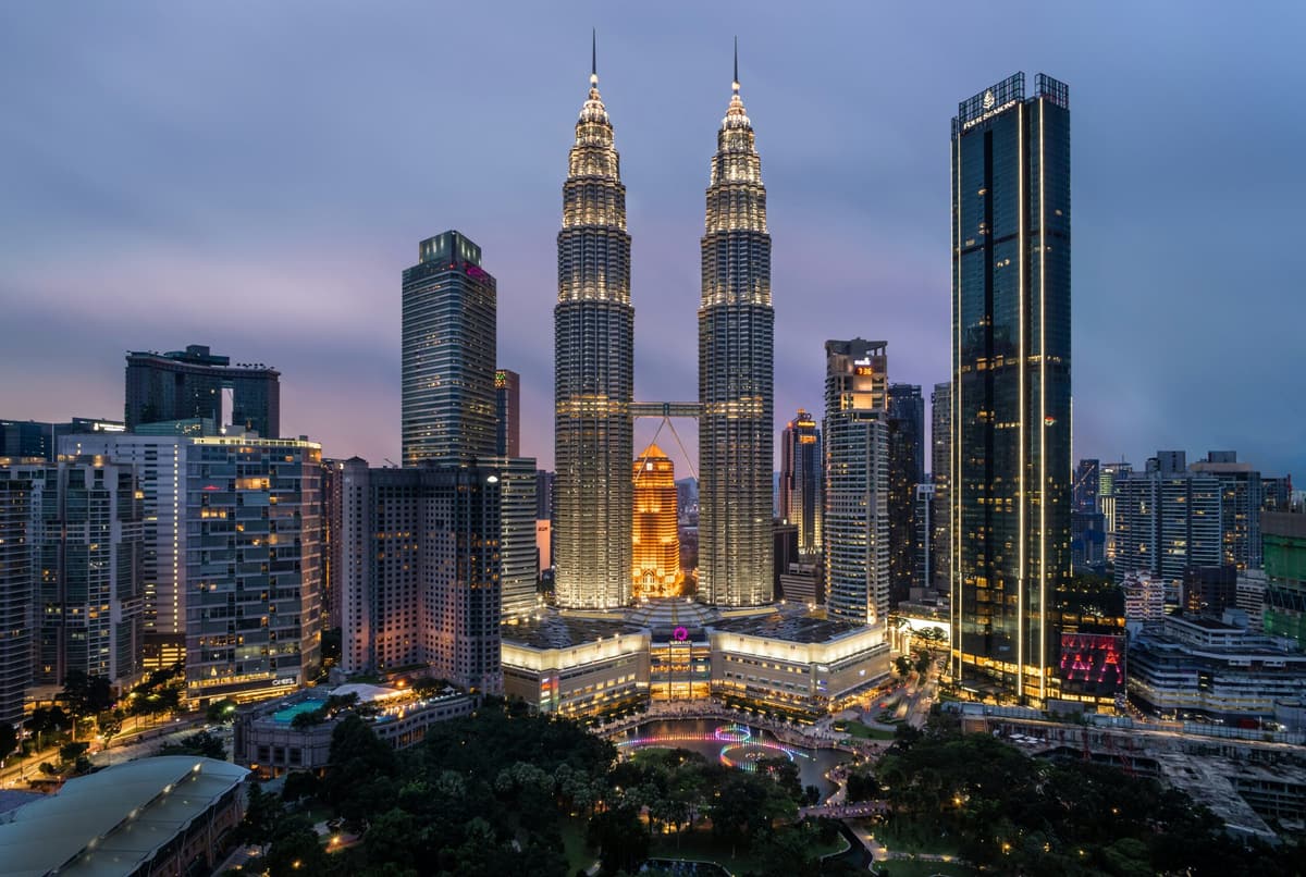 The Petronas Towers and the Kuala Lumpur skyline at dusk